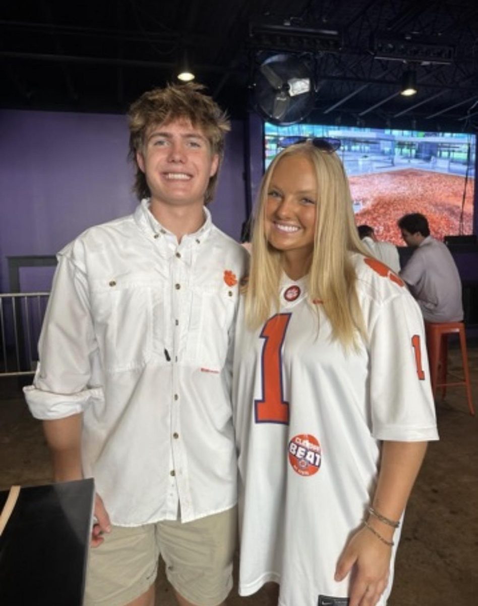 Jack and his sister in Clemson gear at a game watch